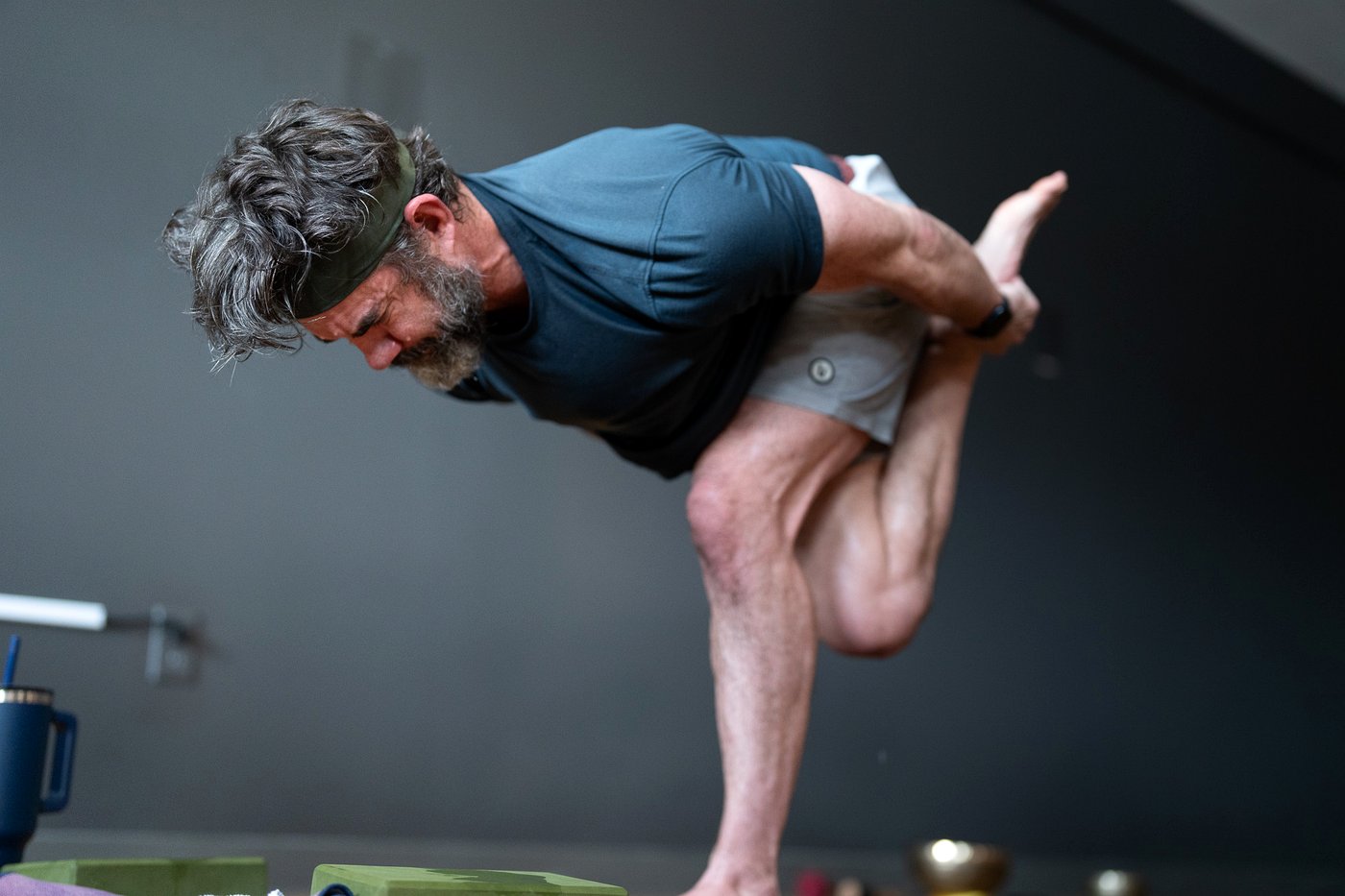 Standing bow posture in the heated Bikram room